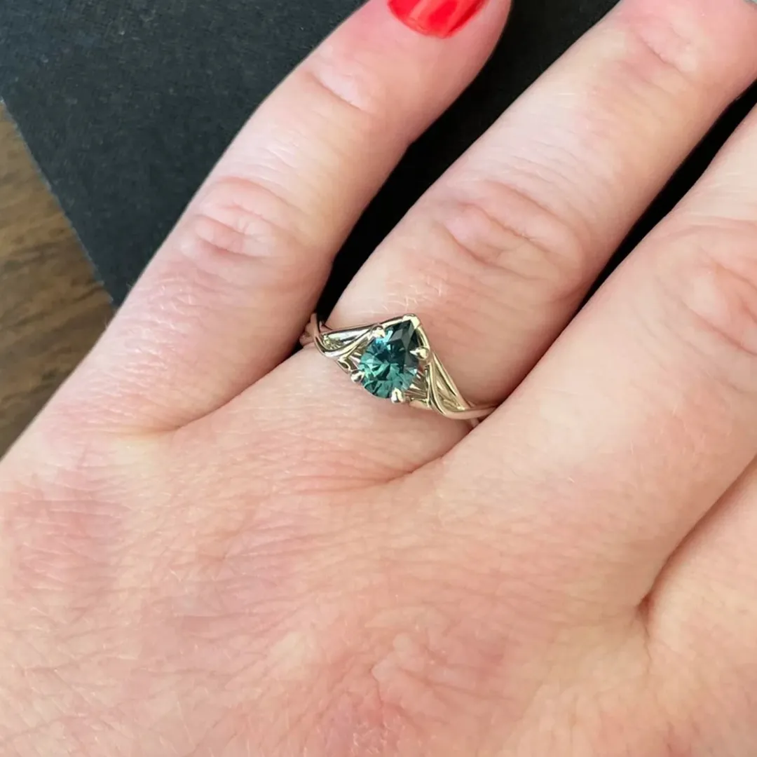 /public/photos/live/Petite Twist Pear Cut Green Moissanite Ring 483 (1).webp